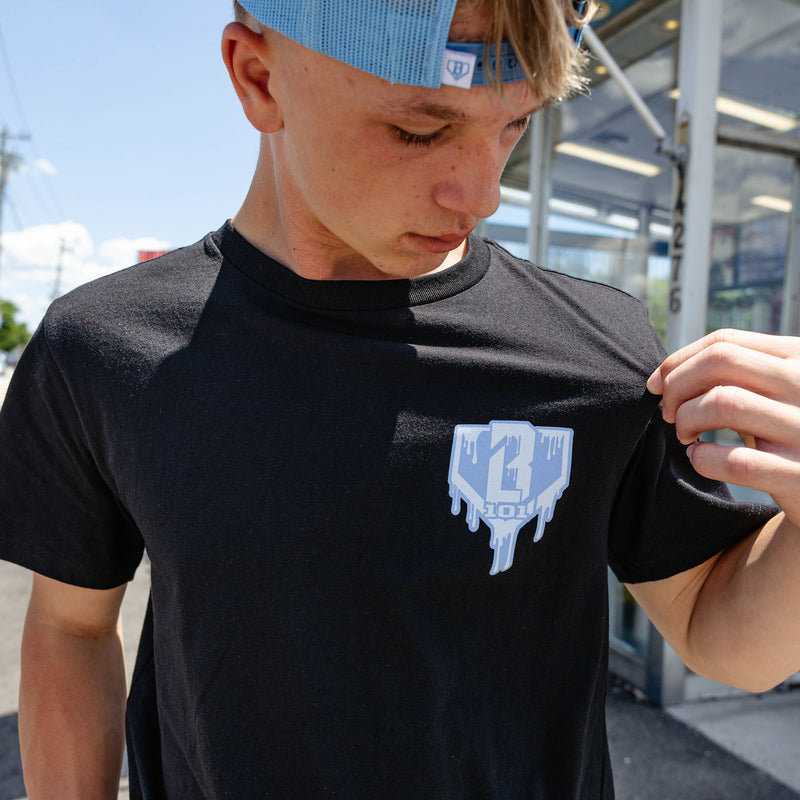 Adult model wearing graphic tee with "Scoop SZN" design