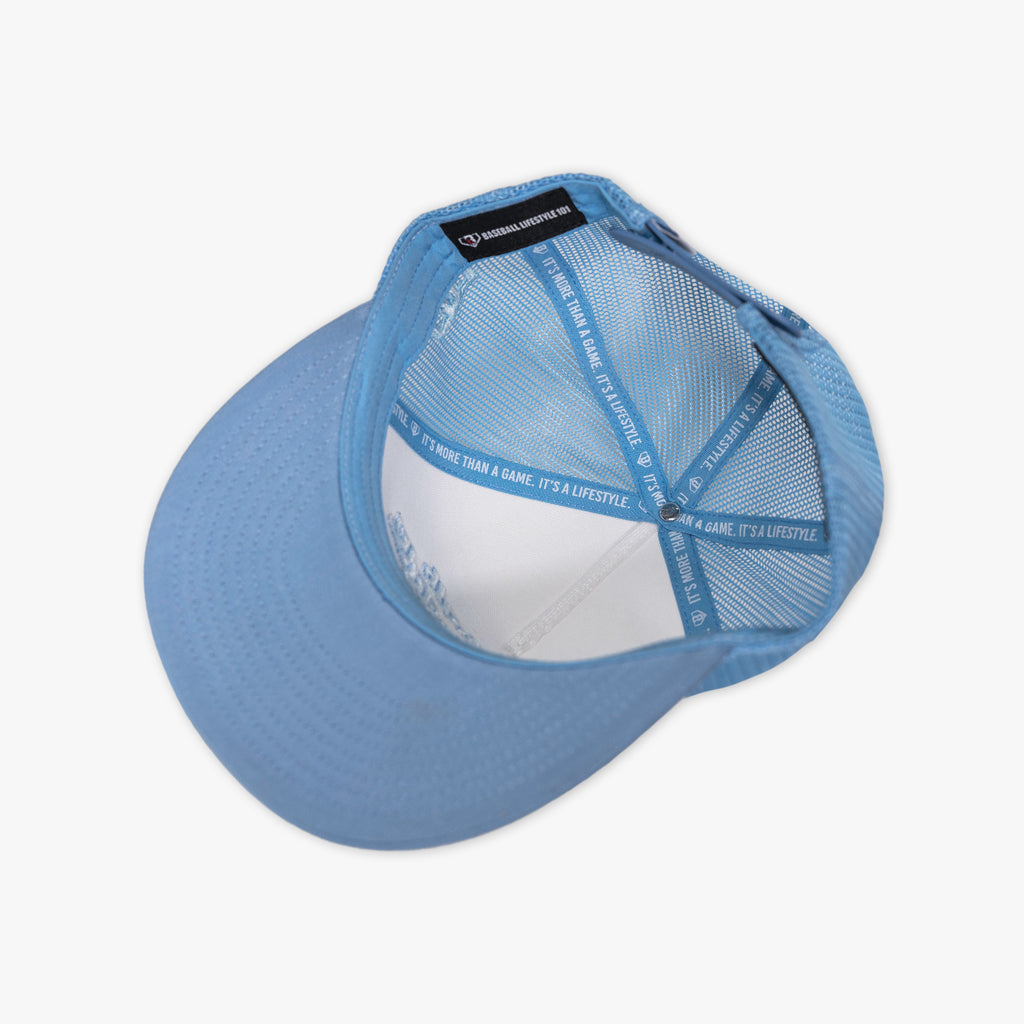 Adult model wearing white and blue Signature Off Field Snapback snapback
