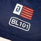 Close up of American flag logo and BL101 logo on navy short sleeve youth hoodie