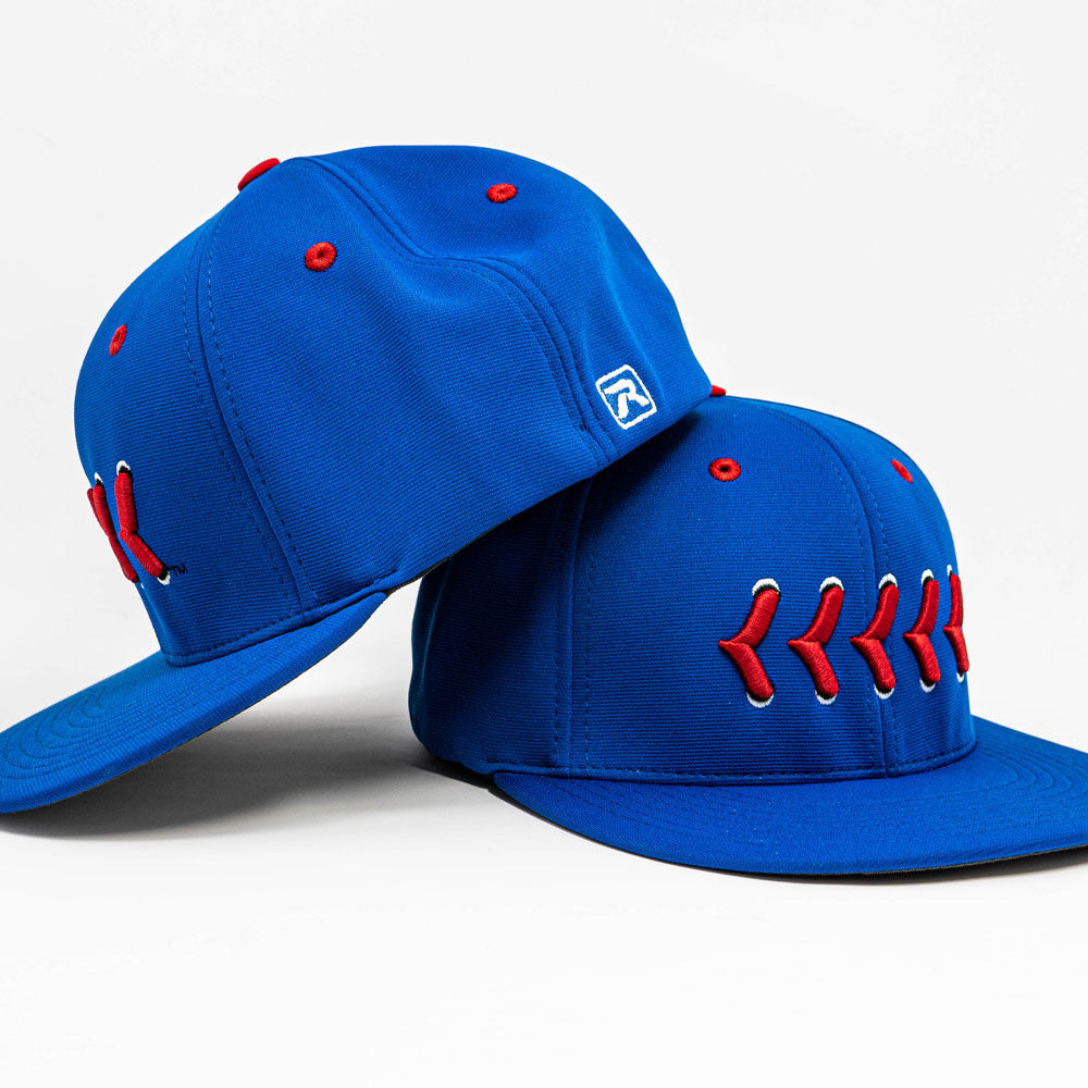 Side View Blue fitted hat with red baseball stitching