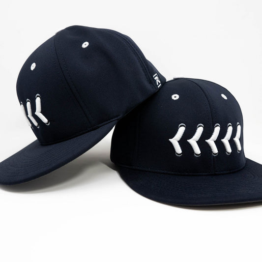Navy fitted hat with white stitching front and side view