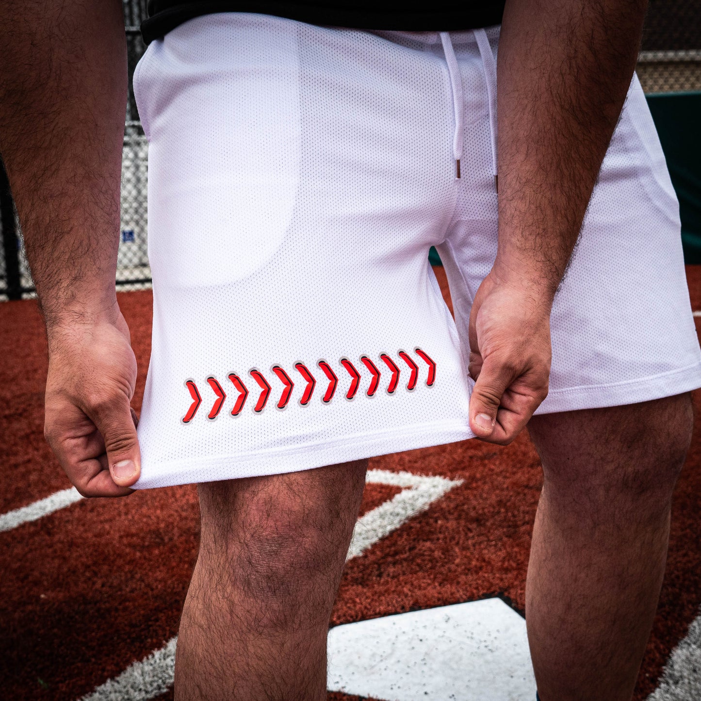 white shorts, white baseball seams, white baseball stitching