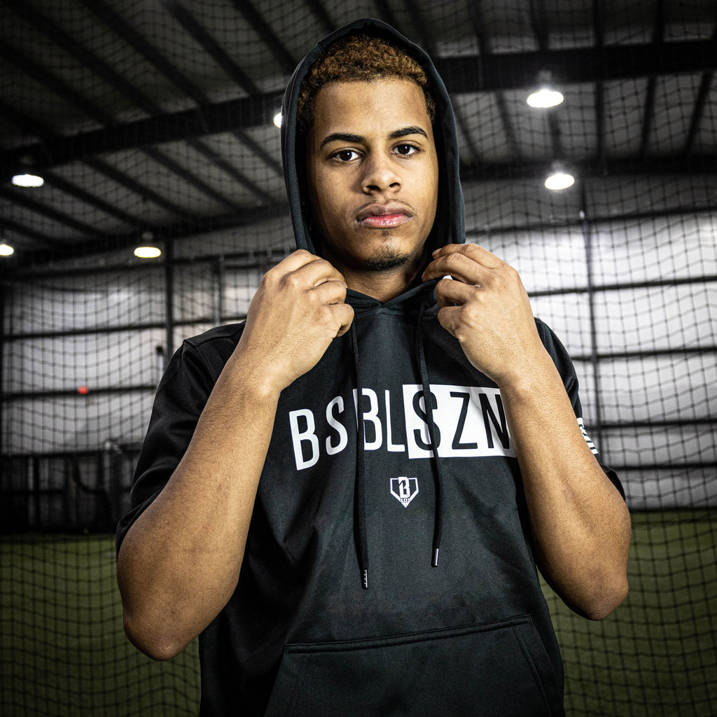 Adult model wearing black and white BSBL-SZN short sleeve hoodie